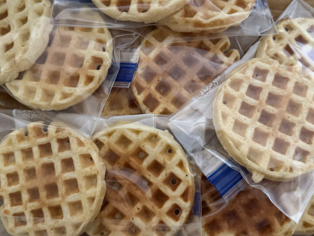 Cooled mini sourdough waffles portioned two per freezer bag